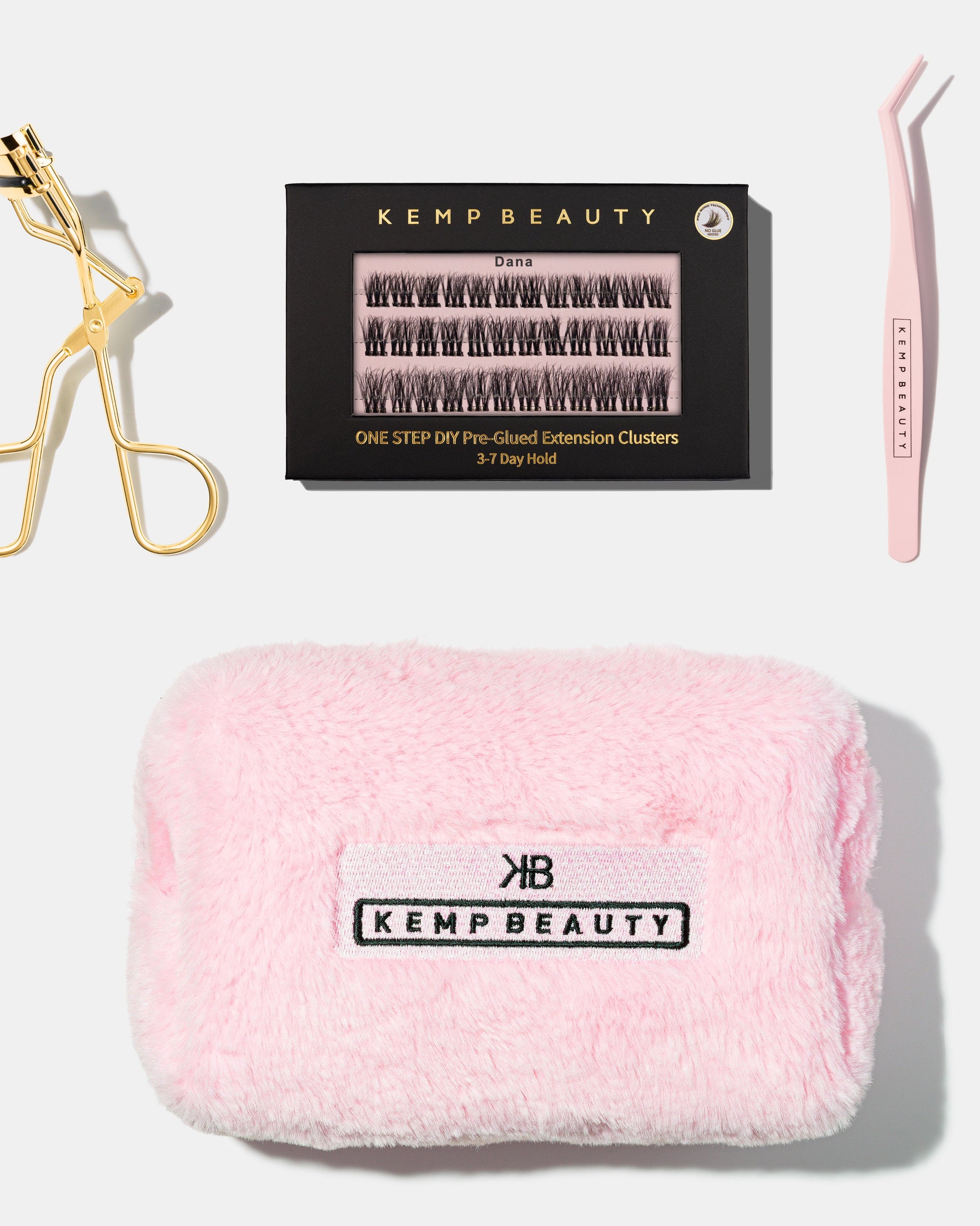 Flat lay of curler, lash cluster box, tweezers, and travel bag from the Max Performance Lash Kit