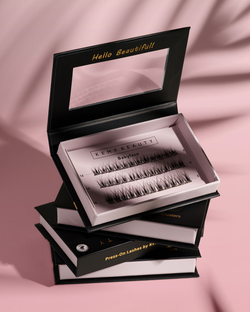 Kend Beauty false eyelashes packaging on a pink background